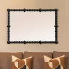 Miroir avec cadre à chevilles et perles de bois chic, noir